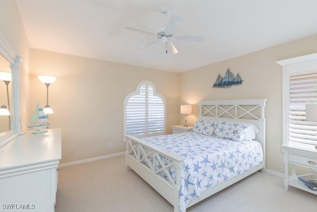 bedroom with light carpet and ceiling fan