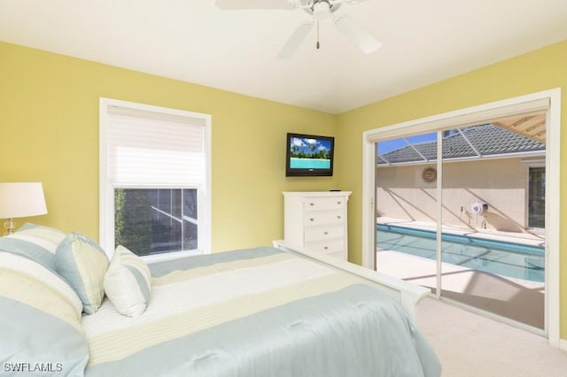 carpeted bedroom featuring access to exterior and ceiling fan