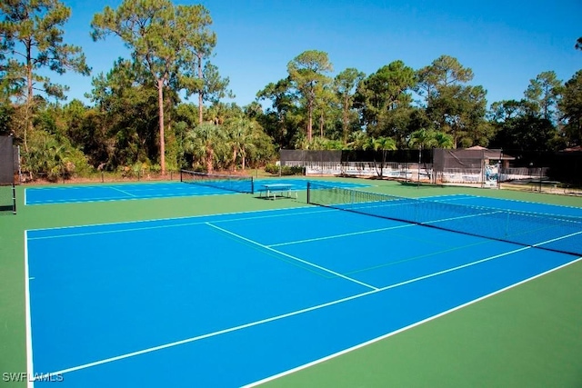 view of sport court with basketball hoop