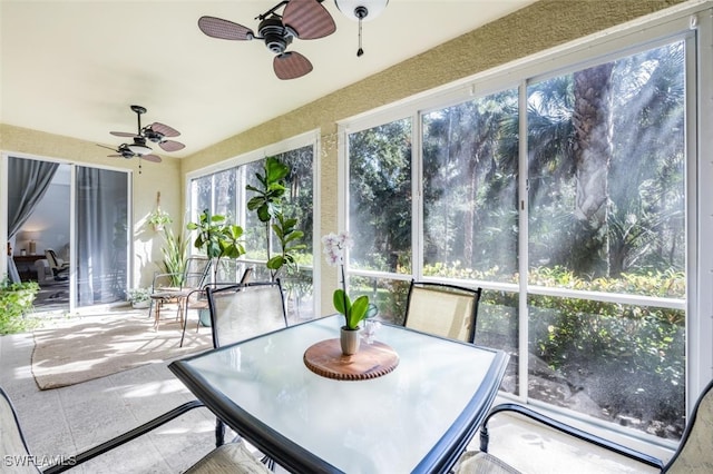 sunroom featuring ceiling fan