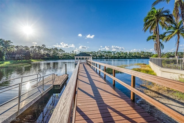 view of dock featuring a water view and a gazebo