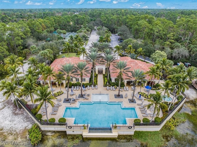 birds eye view of property with a forest view