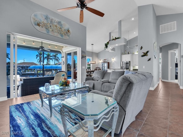 living room featuring tile patterned flooring, high vaulted ceiling, and ceiling fan