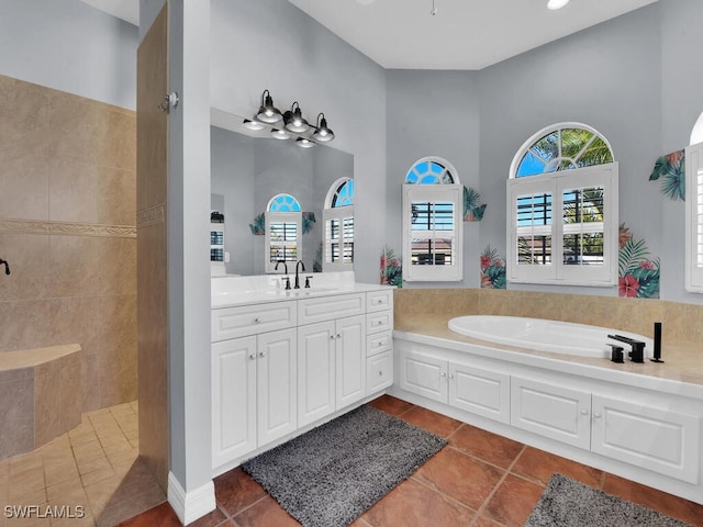 bathroom with separate shower and tub, tile patterned flooring, and vanity