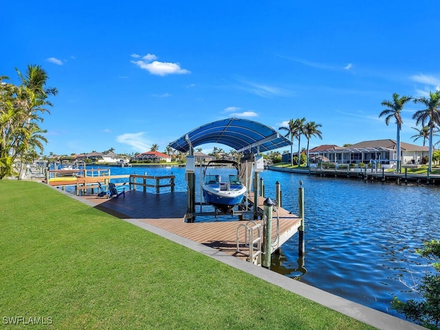 dock area featuring a water view and a yard