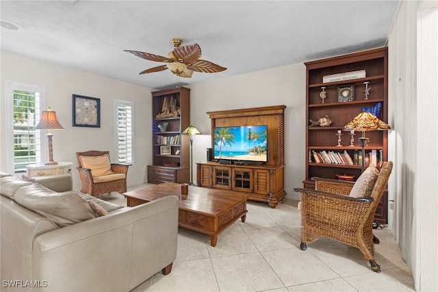 tiled living room featuring ceiling fan