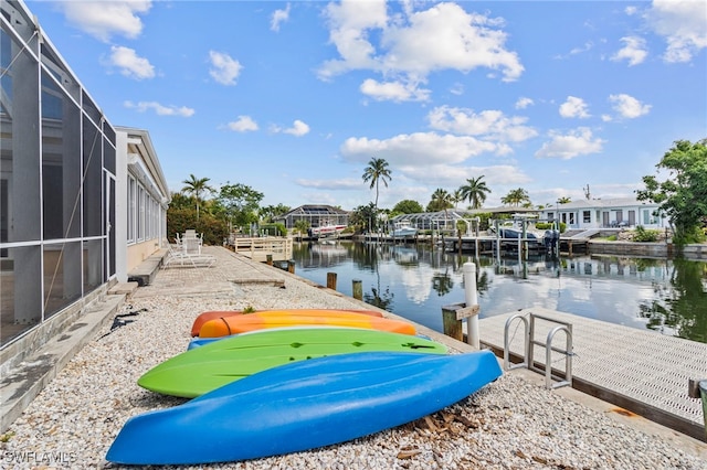 view of dock featuring a water view and a lanai