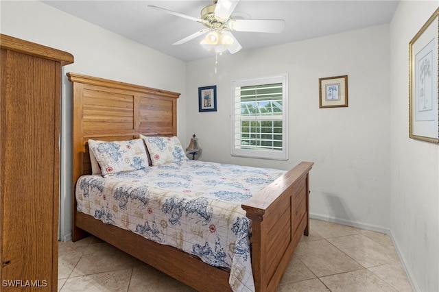 bedroom with ceiling fan and light tile patterned floors