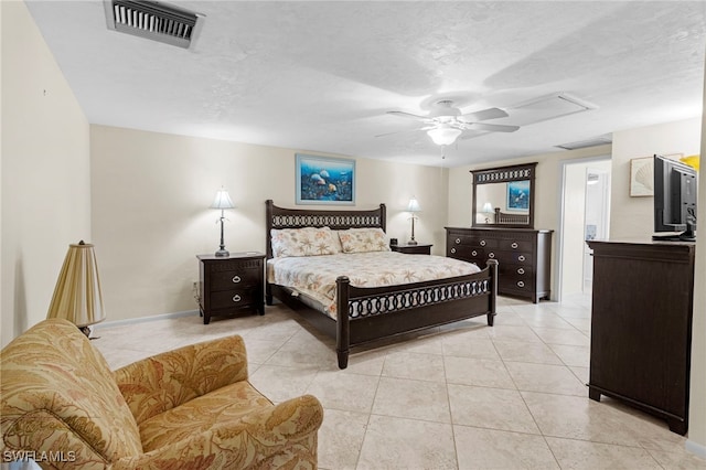 bedroom featuring light tile patterned floors, a textured ceiling, and ceiling fan