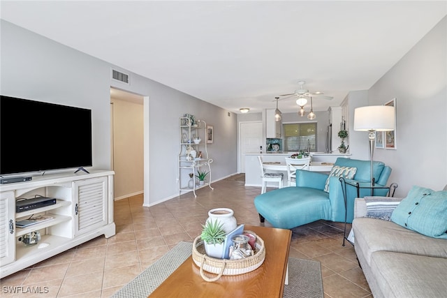 tiled living room with ceiling fan