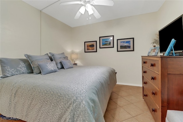 tiled bedroom featuring ceiling fan