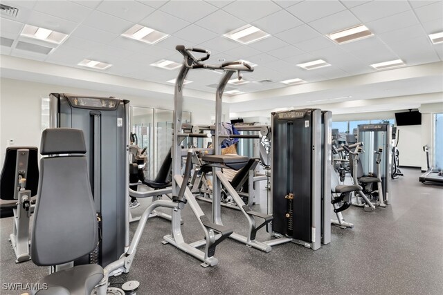 workout area featuring a drop ceiling