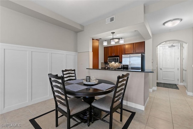 dining space with light tile patterned floors