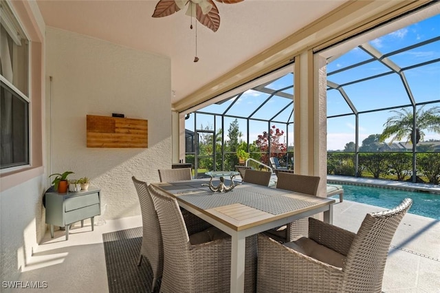 view of patio with ceiling fan and a lanai