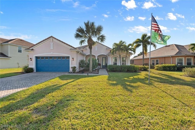 view of front of house with a front yard and a garage