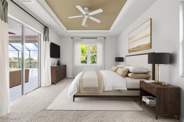 3259 Hampton Blvd, Alva, FL 33920 - bedroom with access to exterior, a tray ceiling, carpet floors, and a ceiling fan