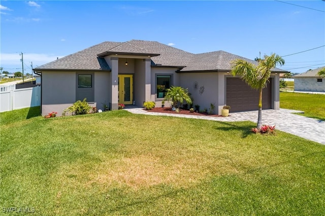 view of front facade featuring a garage and a front lawn