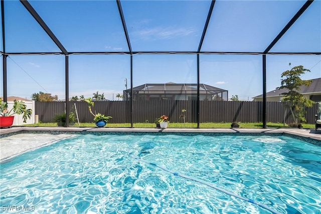 view of pool featuring a lanai