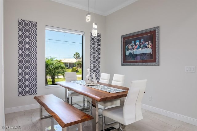 dining area with crown molding