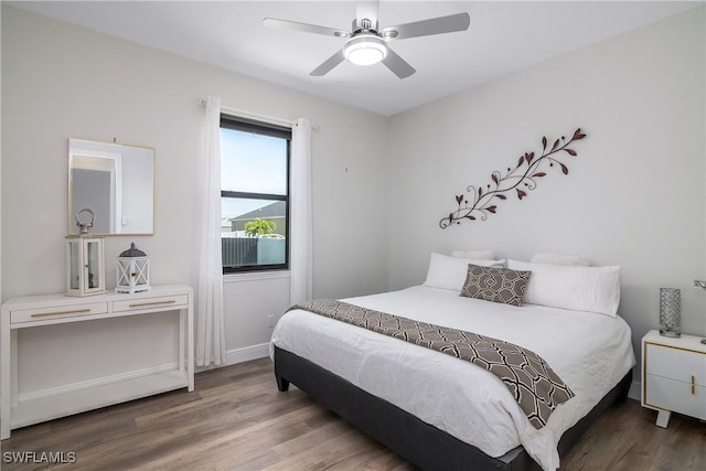 bedroom featuring hardwood / wood-style floors and ceiling fan