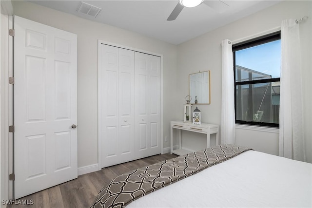 bedroom with hardwood / wood-style floors, a closet, and ceiling fan