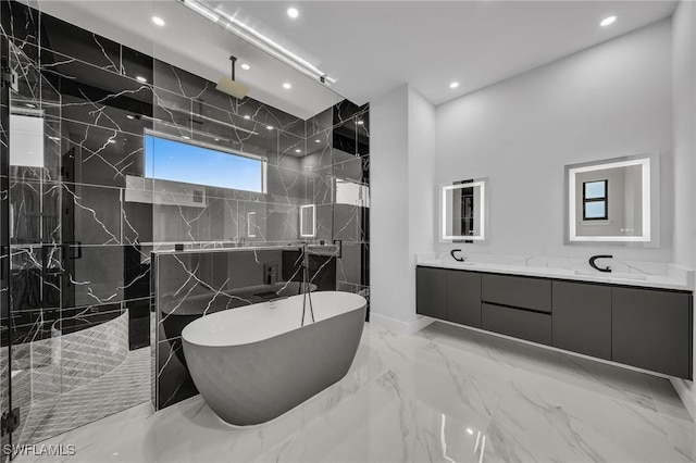 bathroom with shower with separate bathtub and vanity