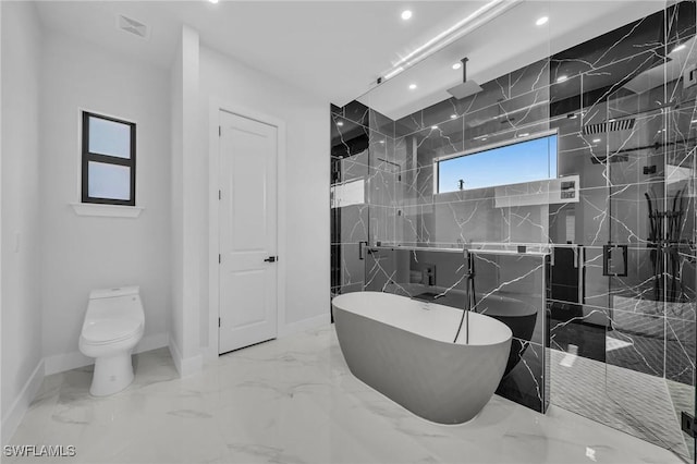 bathroom featuring separate shower and tub and toilet