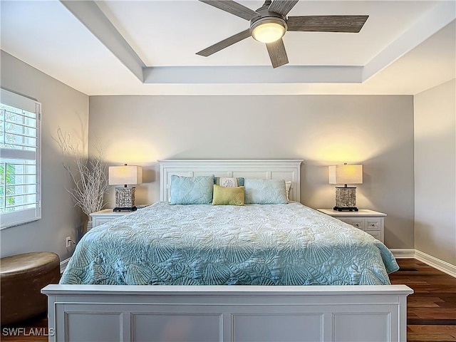 bedroom with ceiling fan and dark hardwood / wood-style flooring