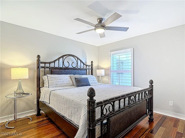 bedroom featuring dark hardwood / wood-style floors and ceiling fan