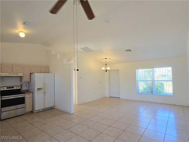 kitchen featuring pendant lighting, white refrigerator with ice dispenser, stainless steel range with electric cooktop, ceiling fan with notable chandelier, and light tile patterned flooring