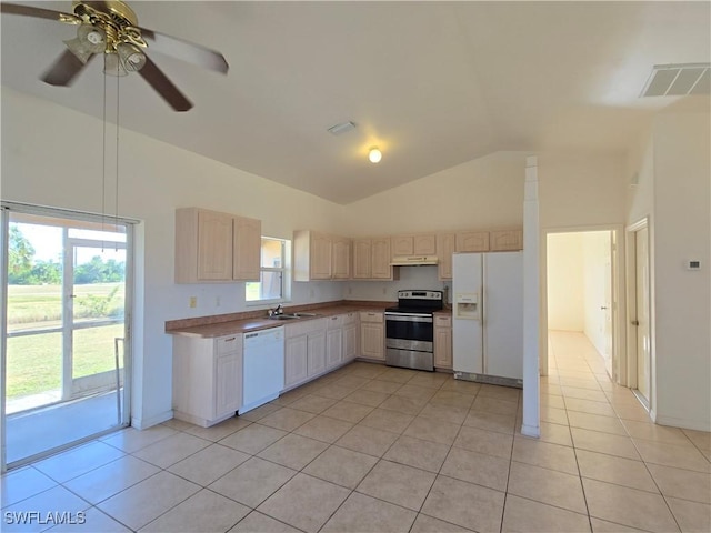 kitchen with light brown cabinets, white appliances, sink, ceiling fan, and light tile patterned floors