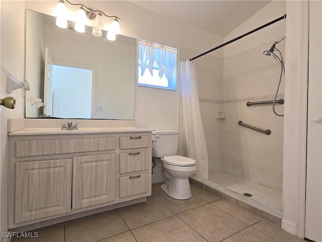 bathroom with tile patterned floors, vanity, toilet, and a shower with curtain