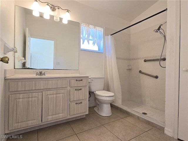 2419 NE 23rd Ave, Cape Coral, FL 33909 - full bathroom with toilet, vanity, a tile shower, and tile patterned flooring