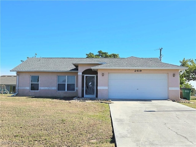 single story home with a garage and a front yard