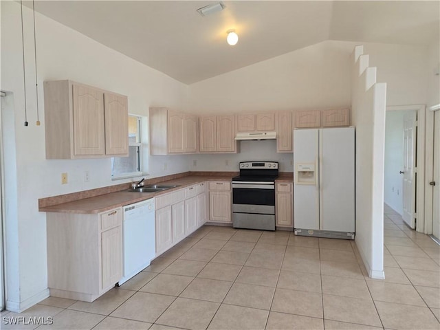 2419 NE 23rd Ave, Cape Coral, FL 33909 - kitchen with white appliances, under cabinet range hood, a sink, light brown cabinets, and vaulted ceiling