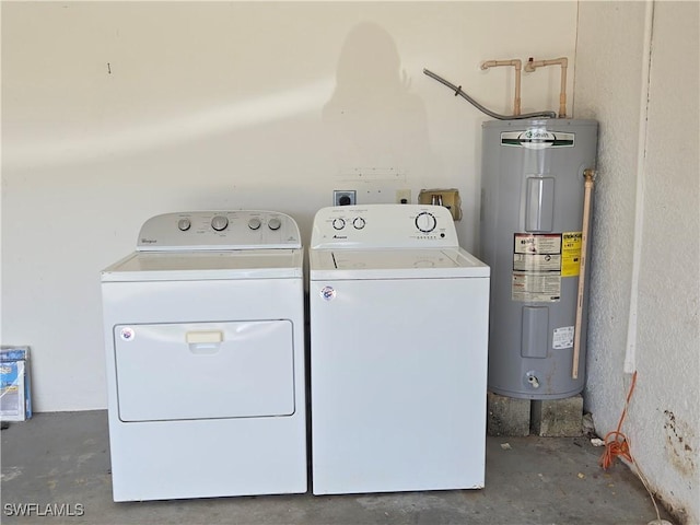 2419 NE 23rd Ave, Cape Coral, FL 33909 - laundry area with water heater and washing machine and clothes dryer