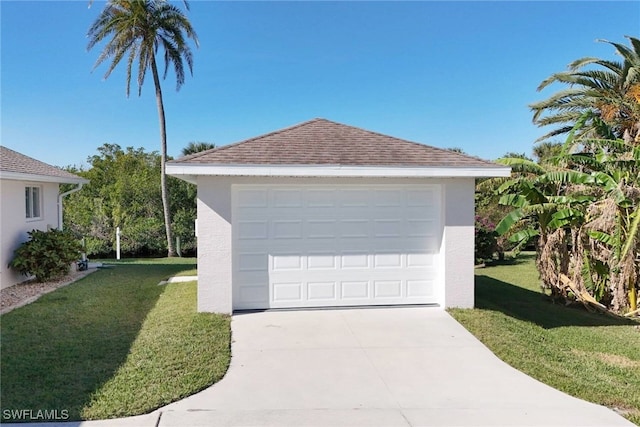 garage with a yard