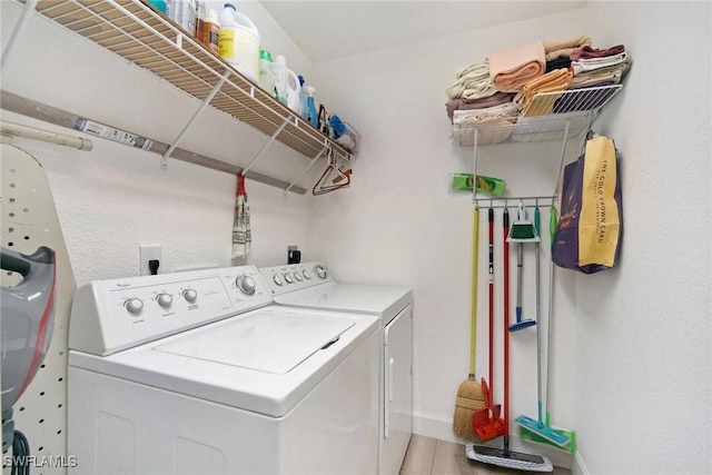 washroom featuring independent washer and dryer and hardwood / wood-style floors