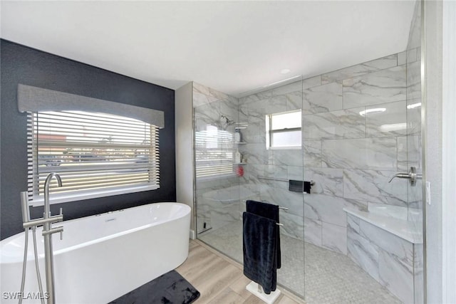 bathroom with separate shower and tub and wood-type flooring