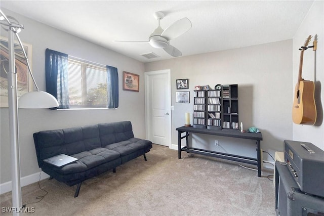 living area featuring ceiling fan and light colored carpet