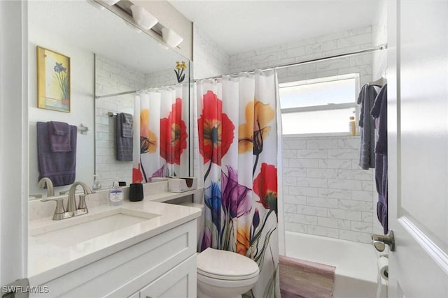 full bathroom with shower / bath combo, toilet, and vanity