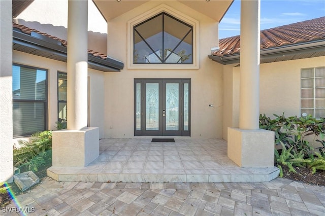 view of exterior entry featuring french doors