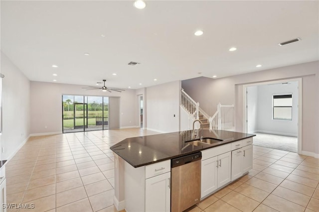 11823 Timbermarsh Ct, Fort Myers, FL 33913 - kitchen featuring stainless steel dishwasher, a sink, dark countertops, light tile patterned floors, and open floor plan