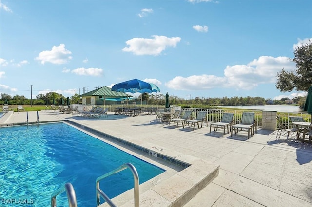 view of swimming pool with a patio area