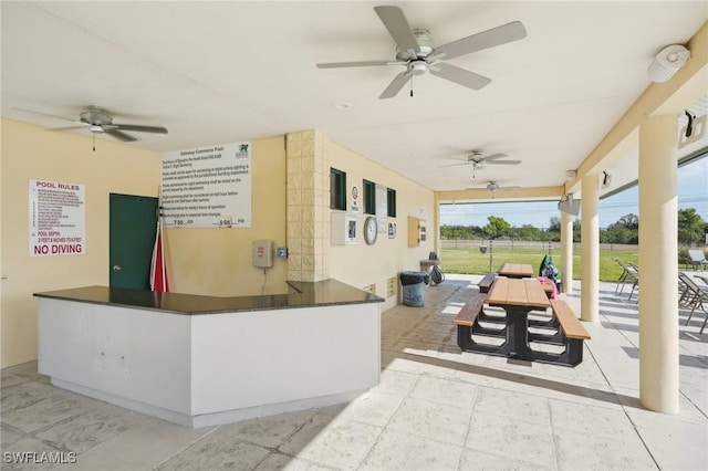 view of patio / terrace featuring ceiling fan