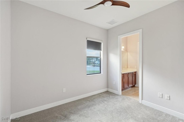 carpeted empty room with ceiling fan