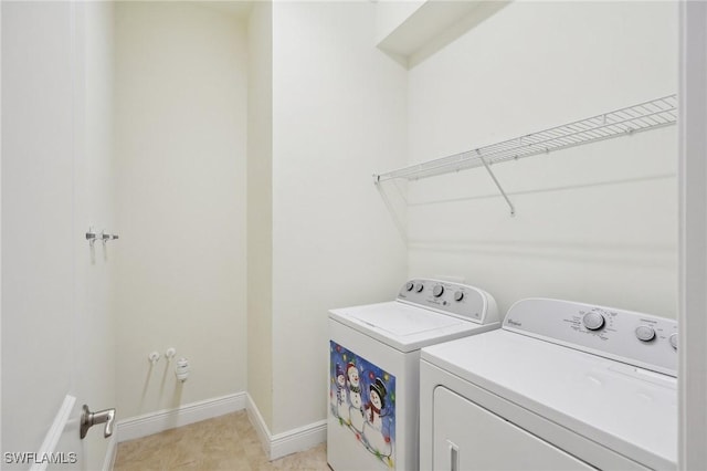 washroom featuring washing machine and clothes dryer