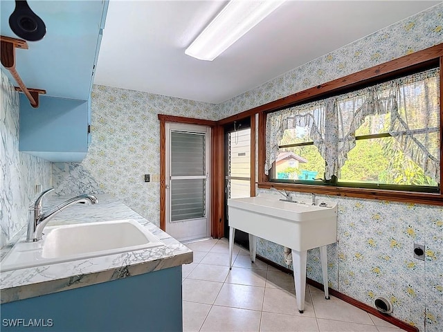 bathroom with tile patterned floors