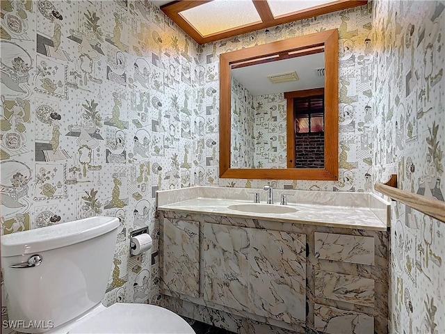 bathroom with sink and toilet