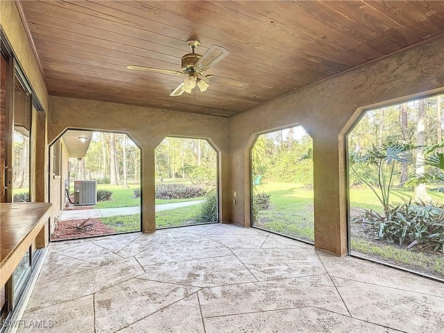 unfurnished sunroom with ceiling fan and wood ceiling